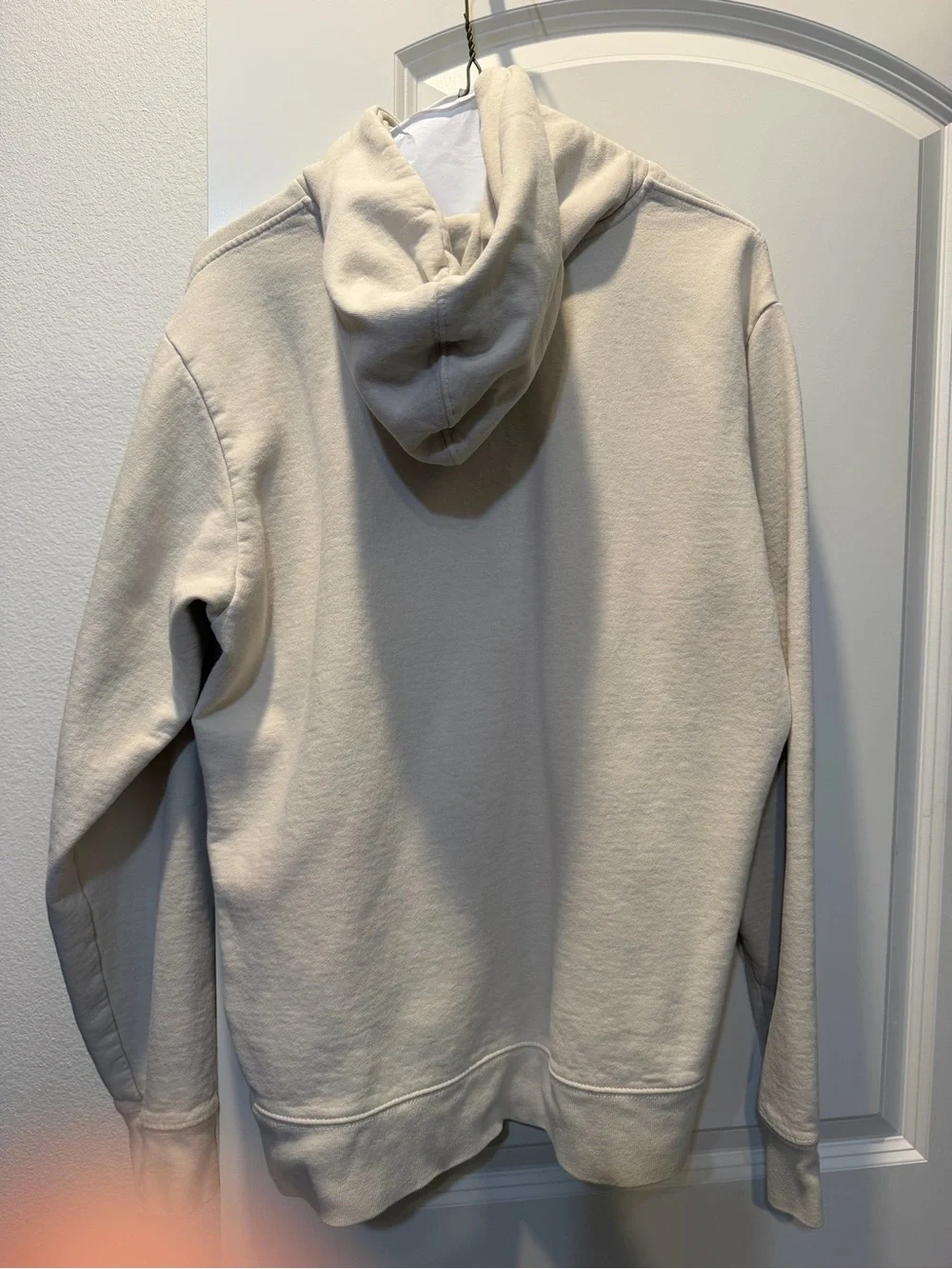 The North Face Light Beige Hoodie with Dark Green Logo